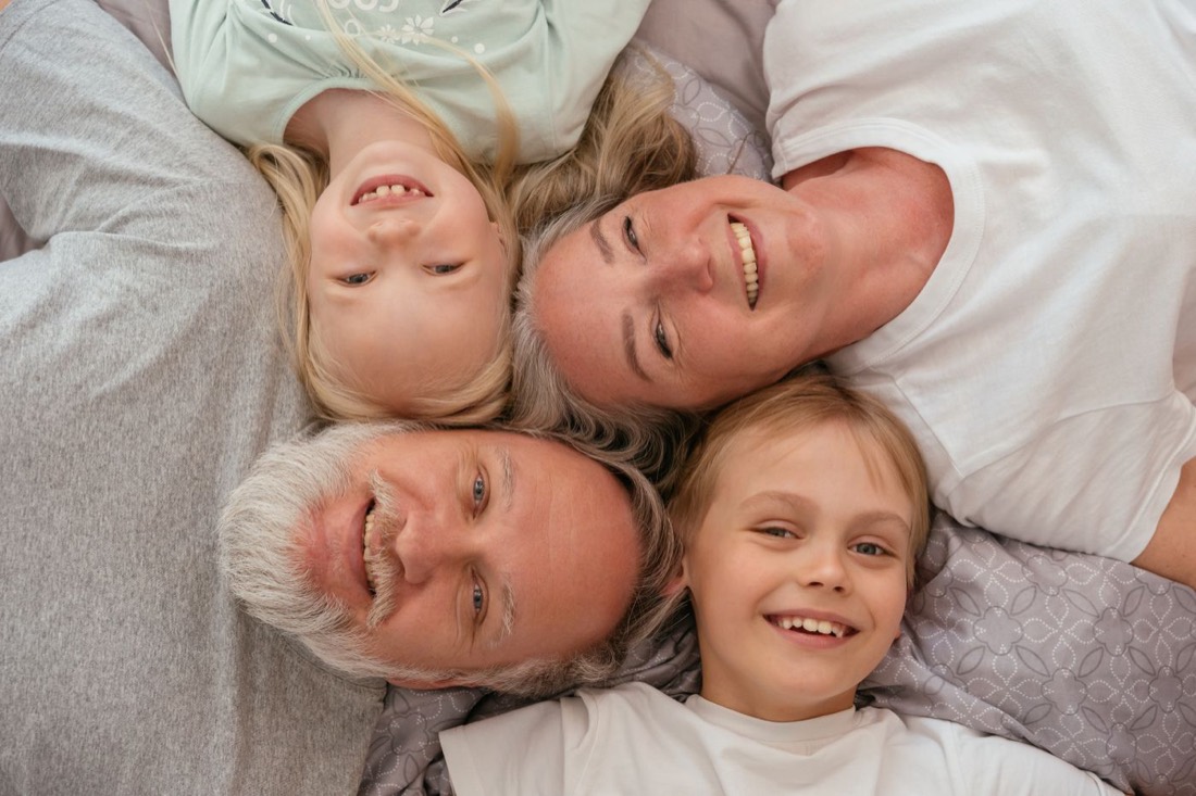 Grandparents and grandchildren laughing together